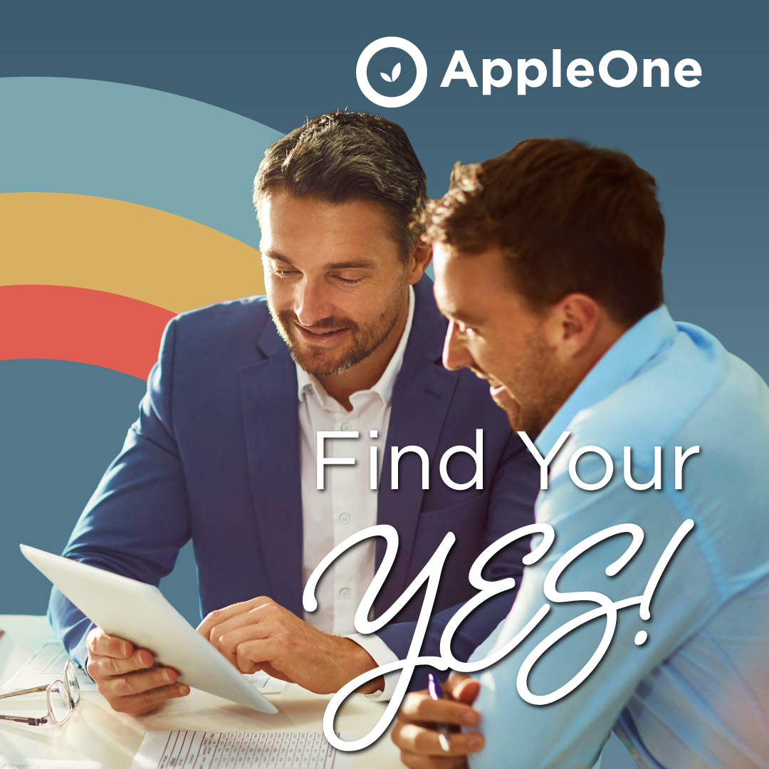 Two men looking over papers at table. The text reads "Find your Yes!"