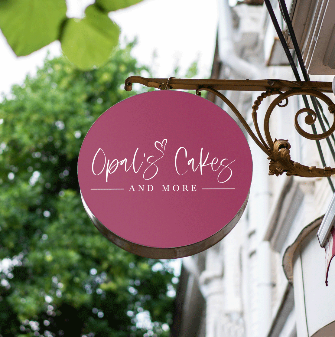 A mockup of a sign with the Opal's Cakes and More logo.