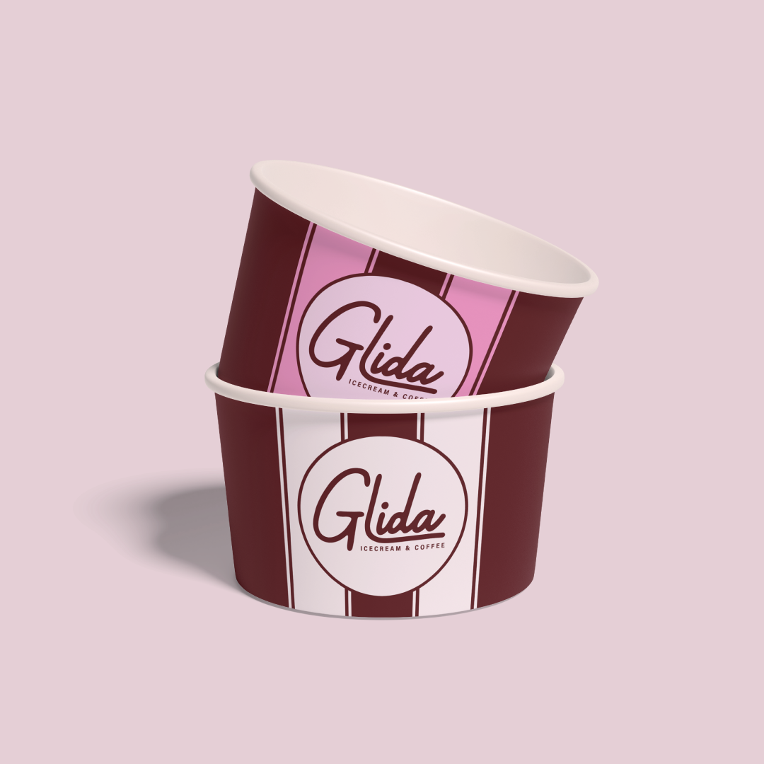 Mockup of a pink ice cream cup and beige ice cream cup, each with the Glida's logo on it.
