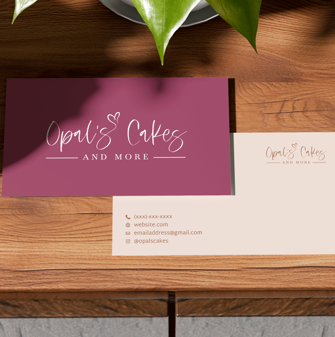 Mockup of the front and back of a business card. The side of the buisness card with the logo is on top of the information side of the business card.