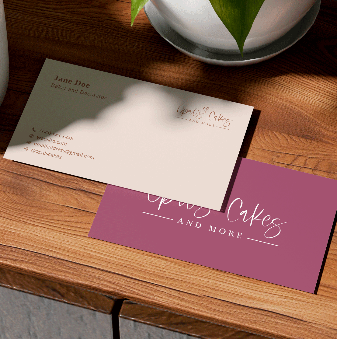 Mockup of the front and back of a business card. The side of the buisness card with the information is on top of the side of card with the logo.