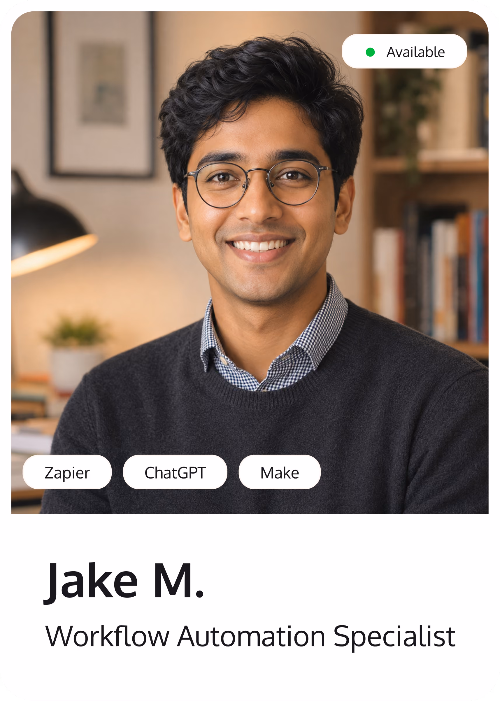 Smiling man with glasses in an office labeled Jake M., Workflow Automation Specialist, status available.