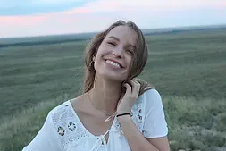 Smiling young woman outdoors