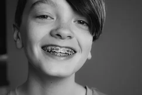 Smiling boy with metal braces