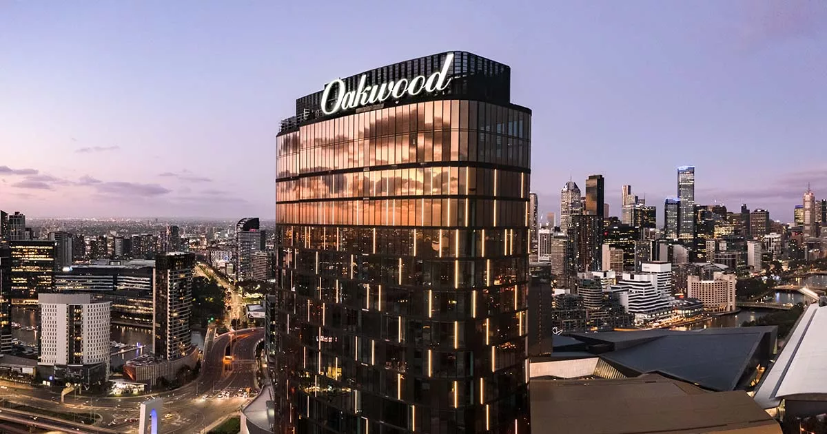 Oakwood hotel high-rise with sunset reflections in glass