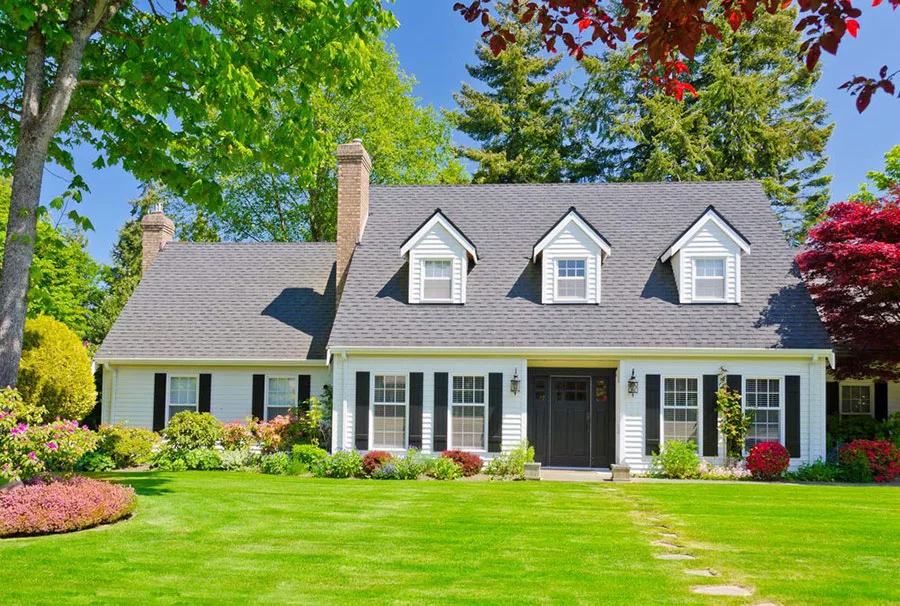Charming white colonial house with black shutters