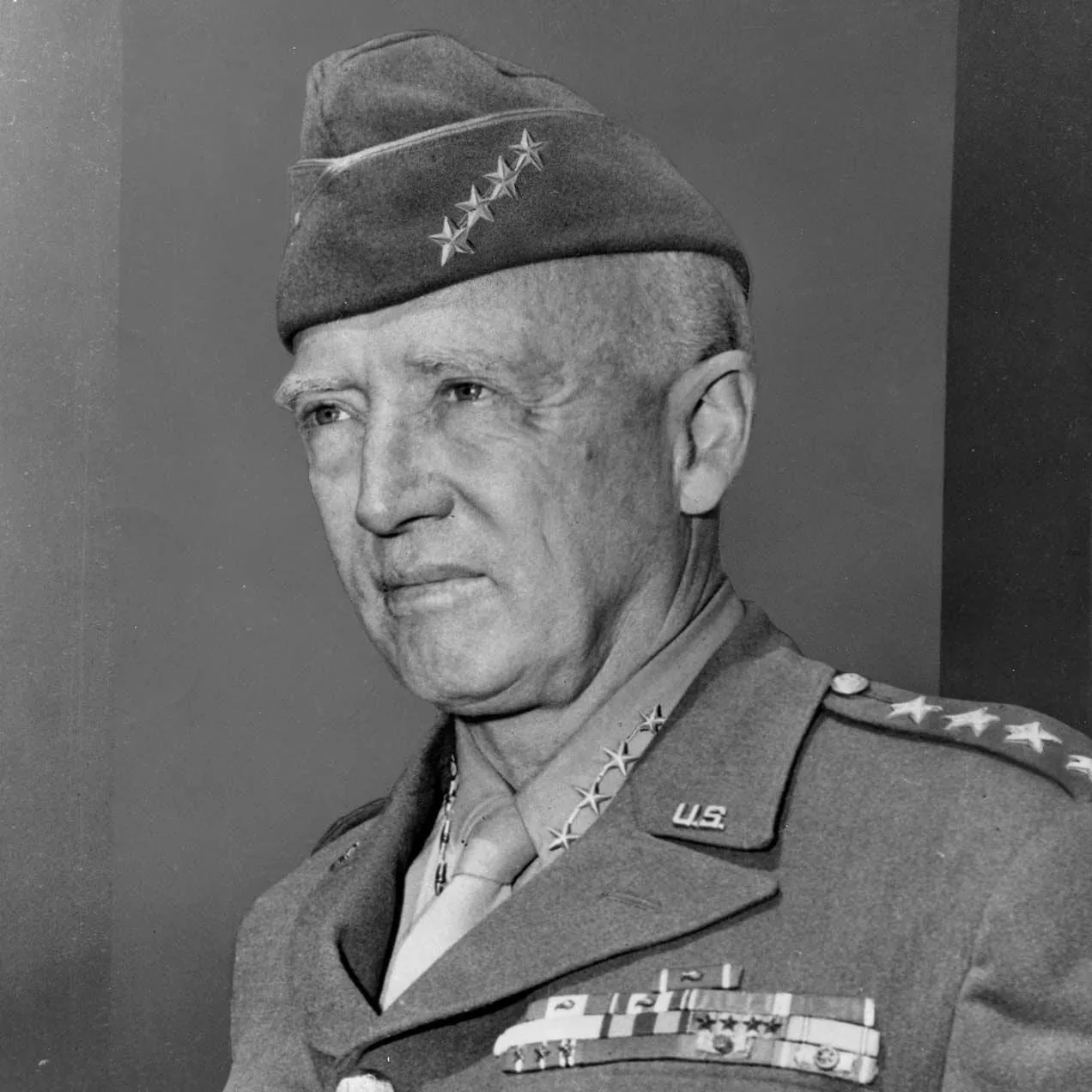 A senior military officer in uniform with four-star insignias and medals