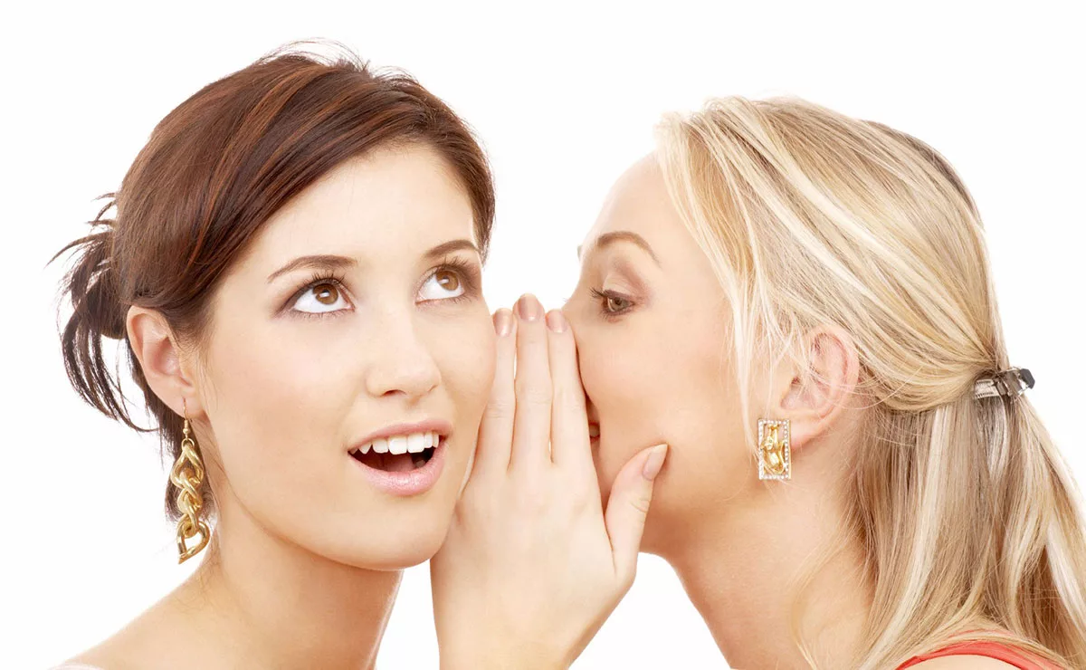 Two women sharing a secret