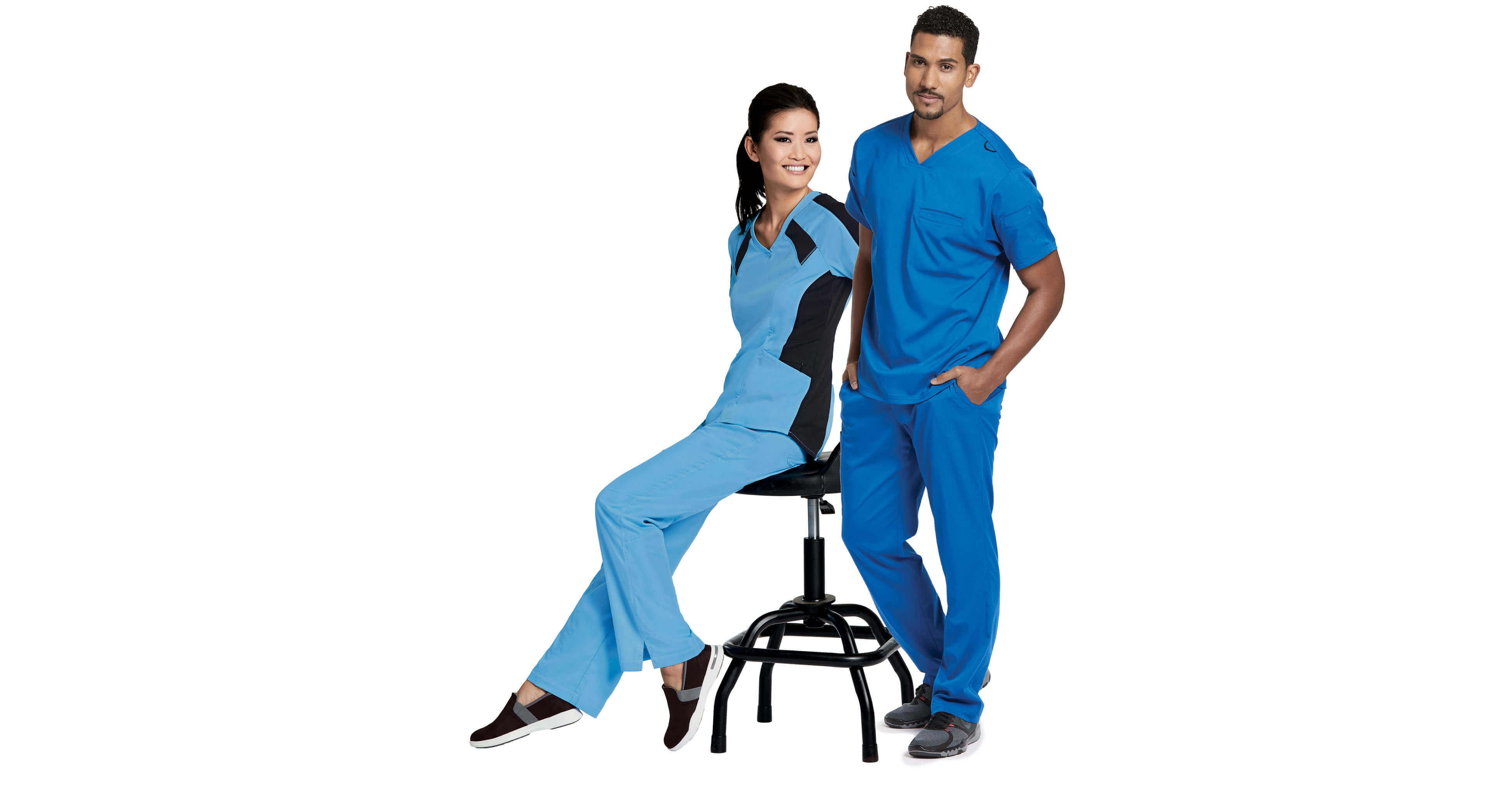Two healthcare professionals in blue scrubs
