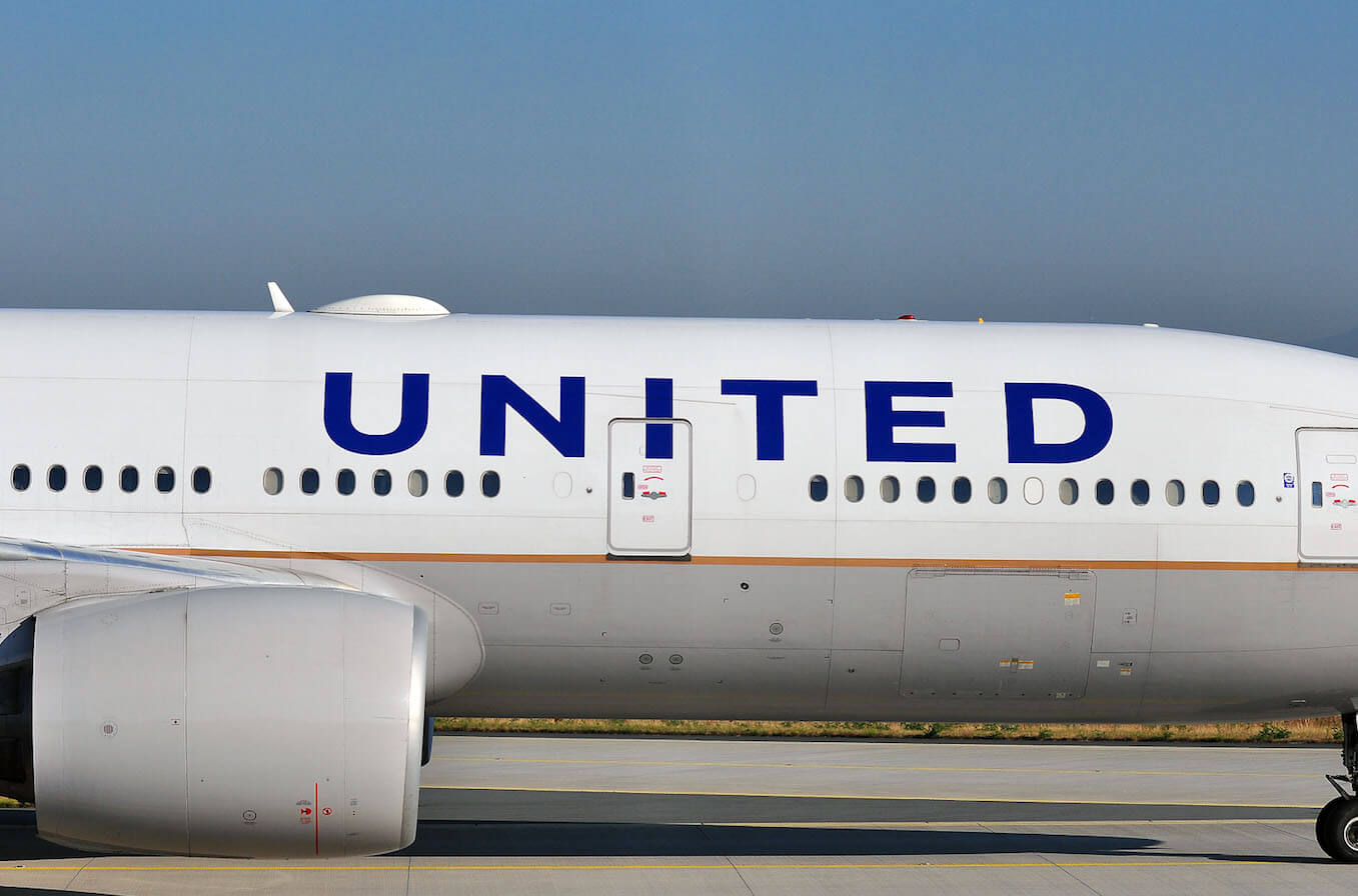 Side view of a United Airlines jet on the runway