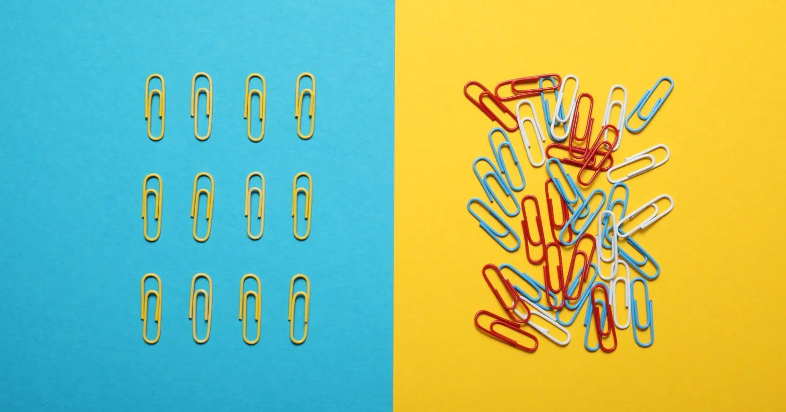 Lined up paper clips next to a messy pile of paper clips.