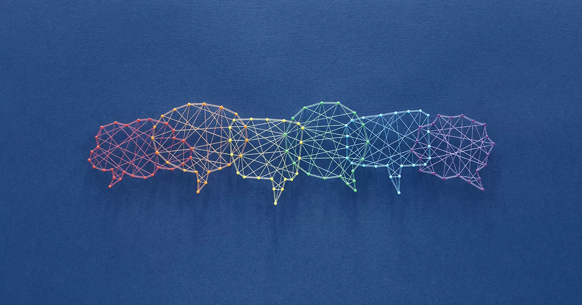 Colorful thread speech bubbles on a blue background represent communication and networking.