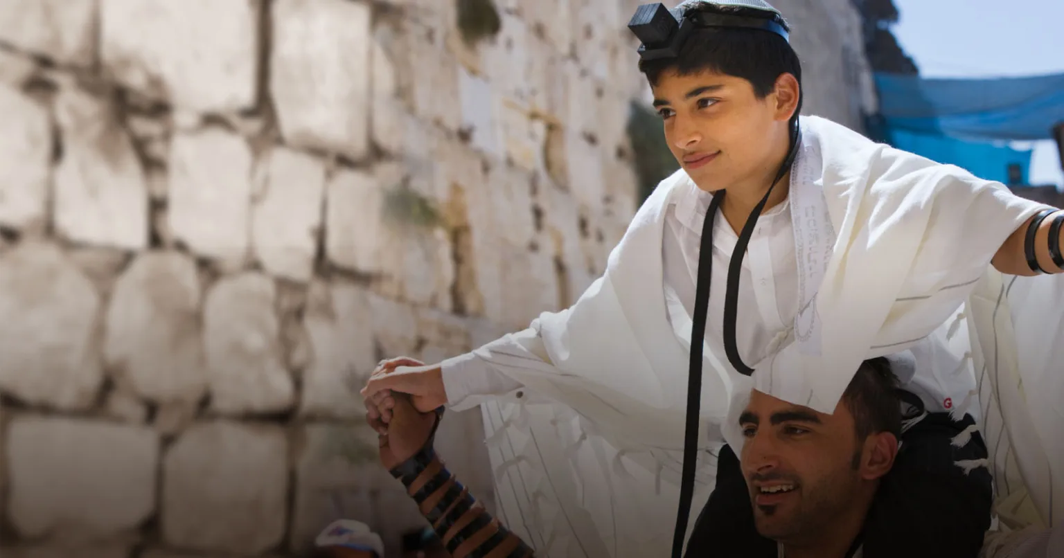 Boy celebrating Bar Mitzvah at the Western Wall