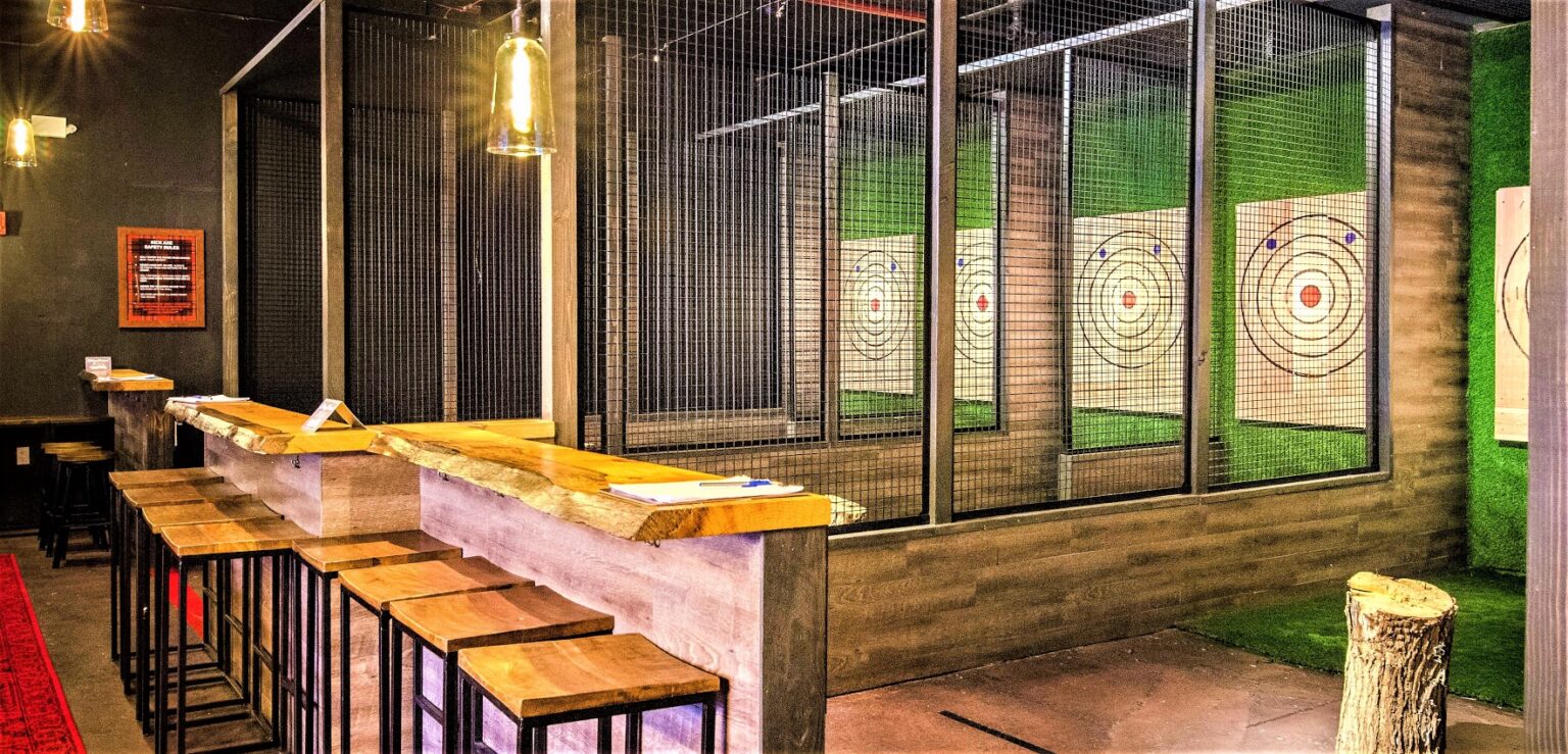 Axe throwing lanes with wooden targets