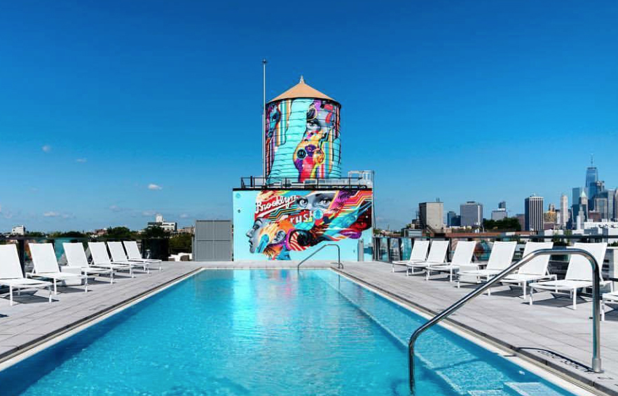 Rooftop pool with lounge chairs