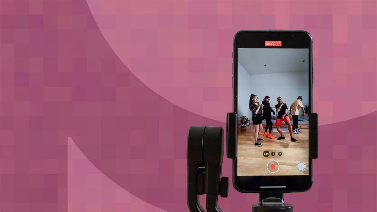 Phone on tripod filming group dancing