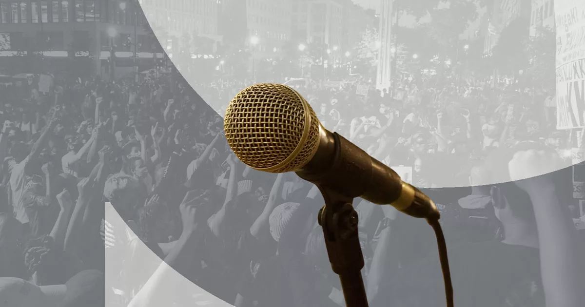 Microphone with a protest crowd background
