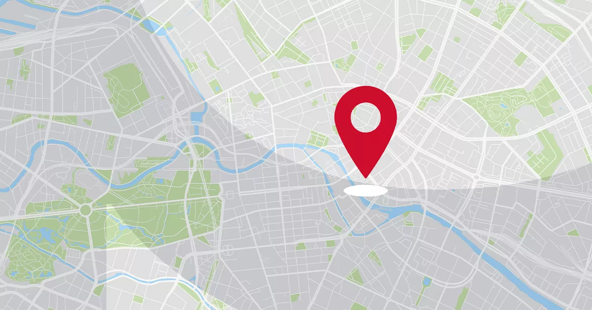 Map with a large red location pin highlighting central streets and green park areas