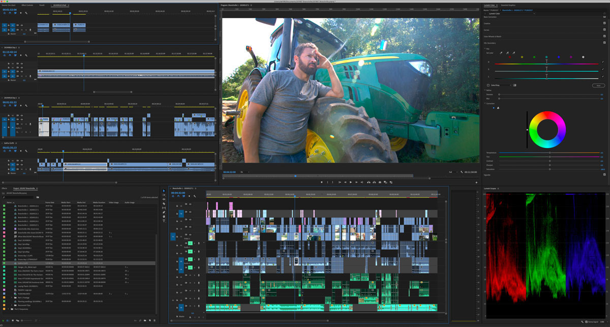 A man reviews video editing software beside a green tractor, highlighting agricultural content creation tools.