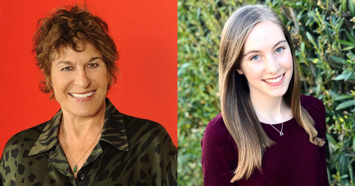 Two smiling women; one in a patterned shirt against a red backdrop