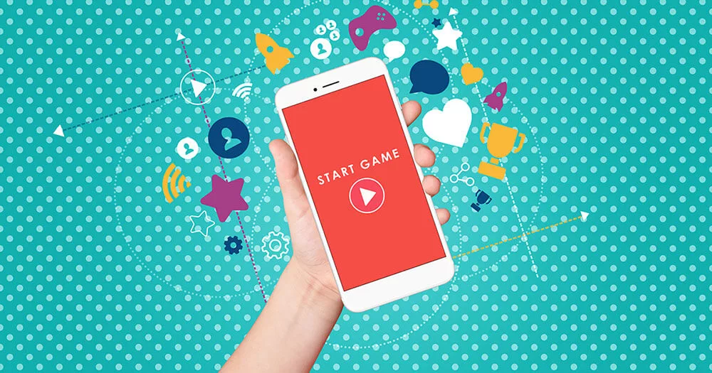 Hand holds a smartphone displaying "Start Game" against a dotted teal background with floating gaming icons.