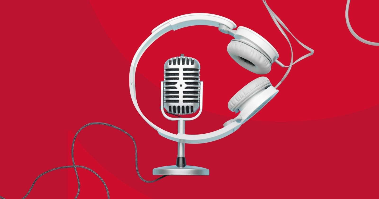 A headset and microphone crossing wires against a red background.