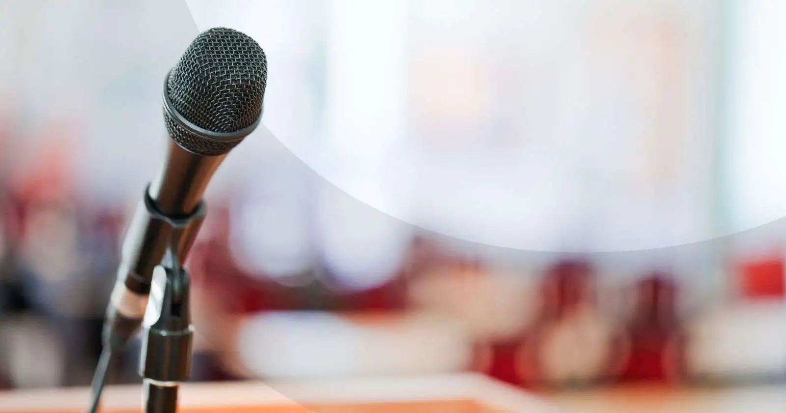 Microphone stand in front of a crowd