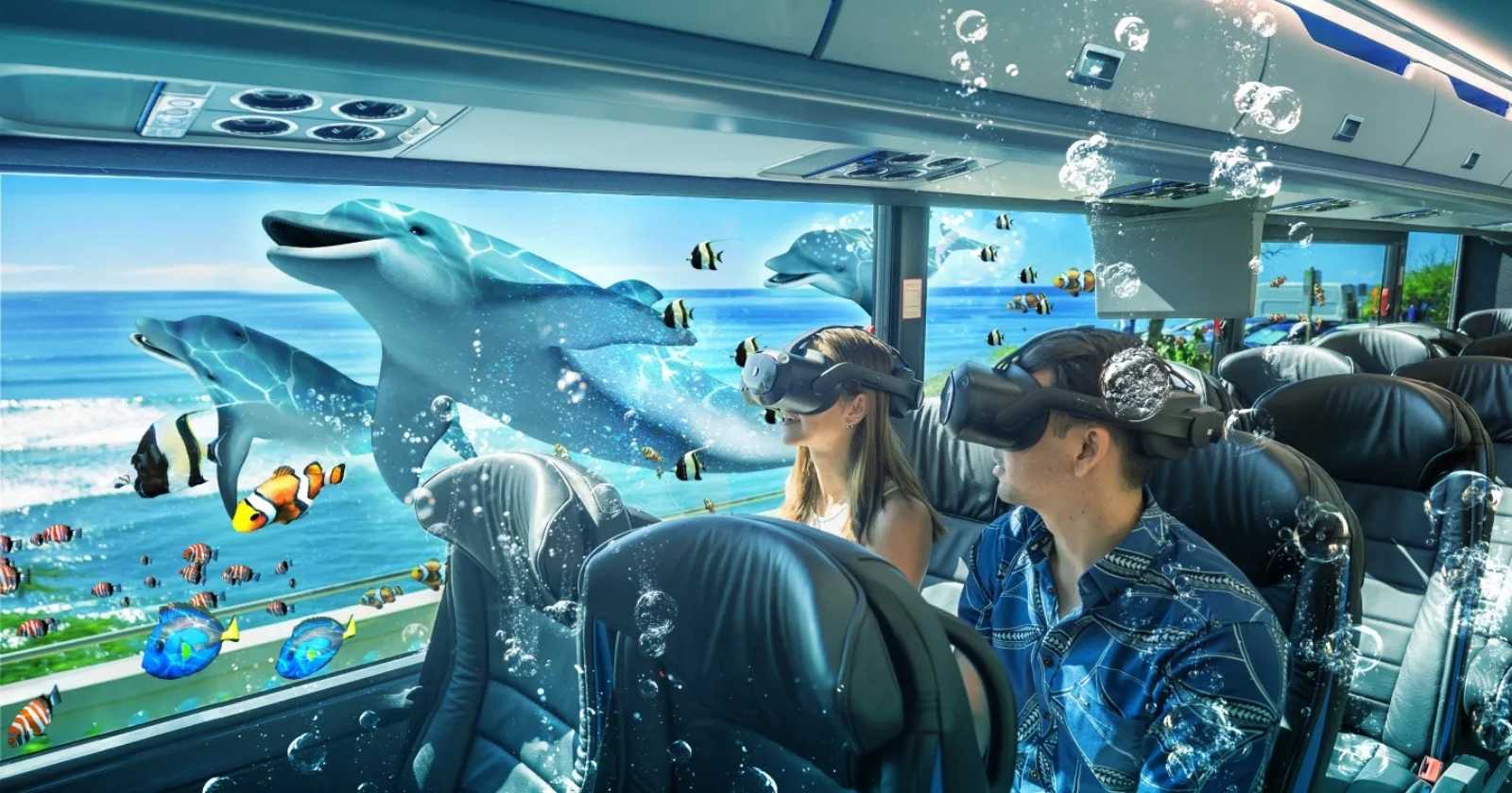 A man and a woman on a bus with VR headsets watching dolphins swim by their window