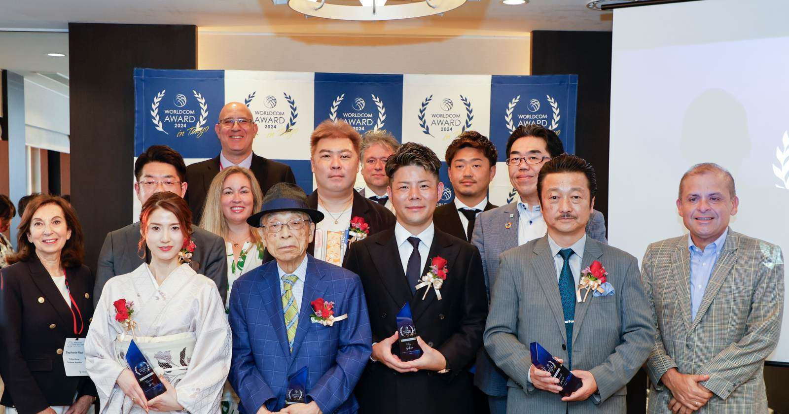 Group of award winners in formal attire