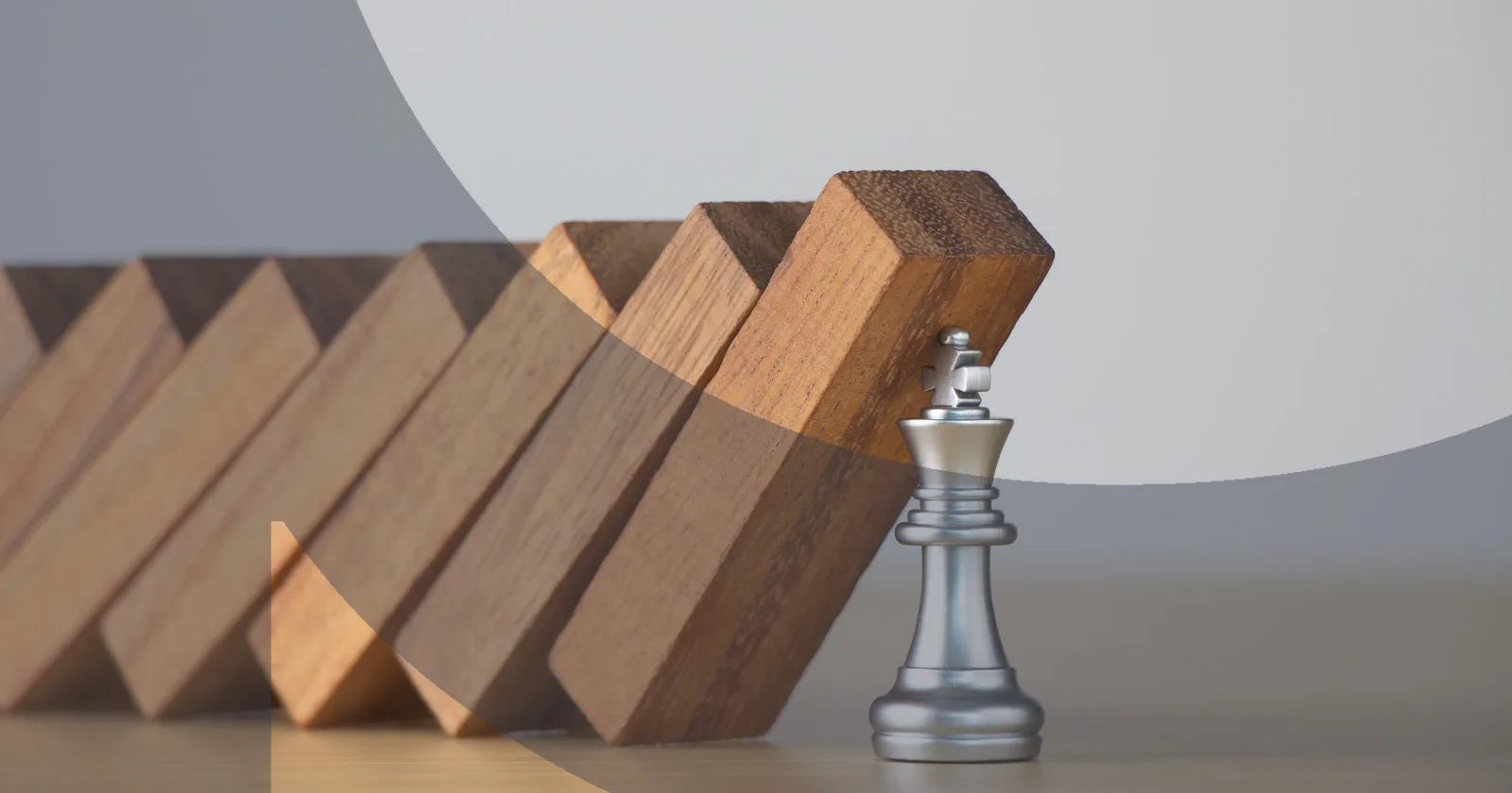 Chess king stops falling wooden blocks