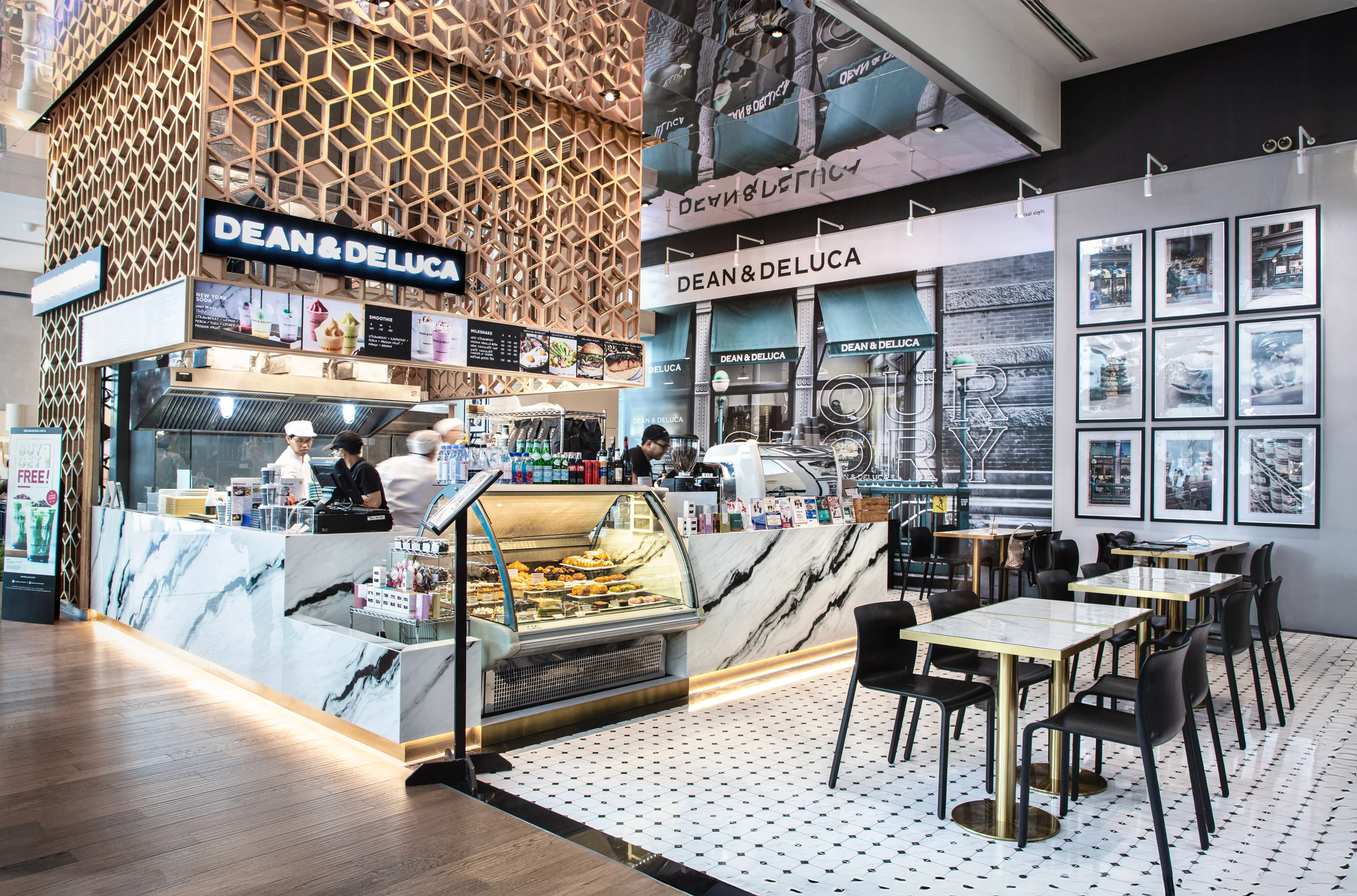 A DEAN & DELUCA cafe with food display counters and a tiled seating area.
