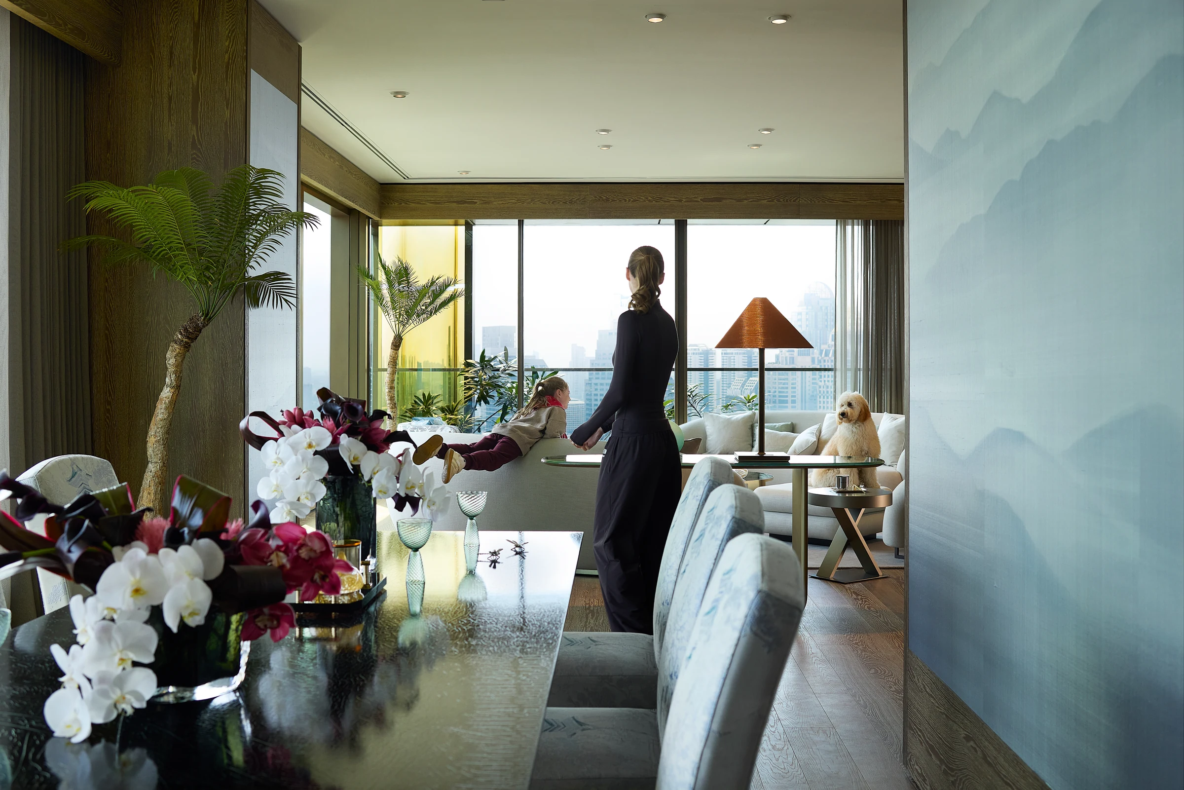 A Sunrise Residence dining area opening toward a bright living room.