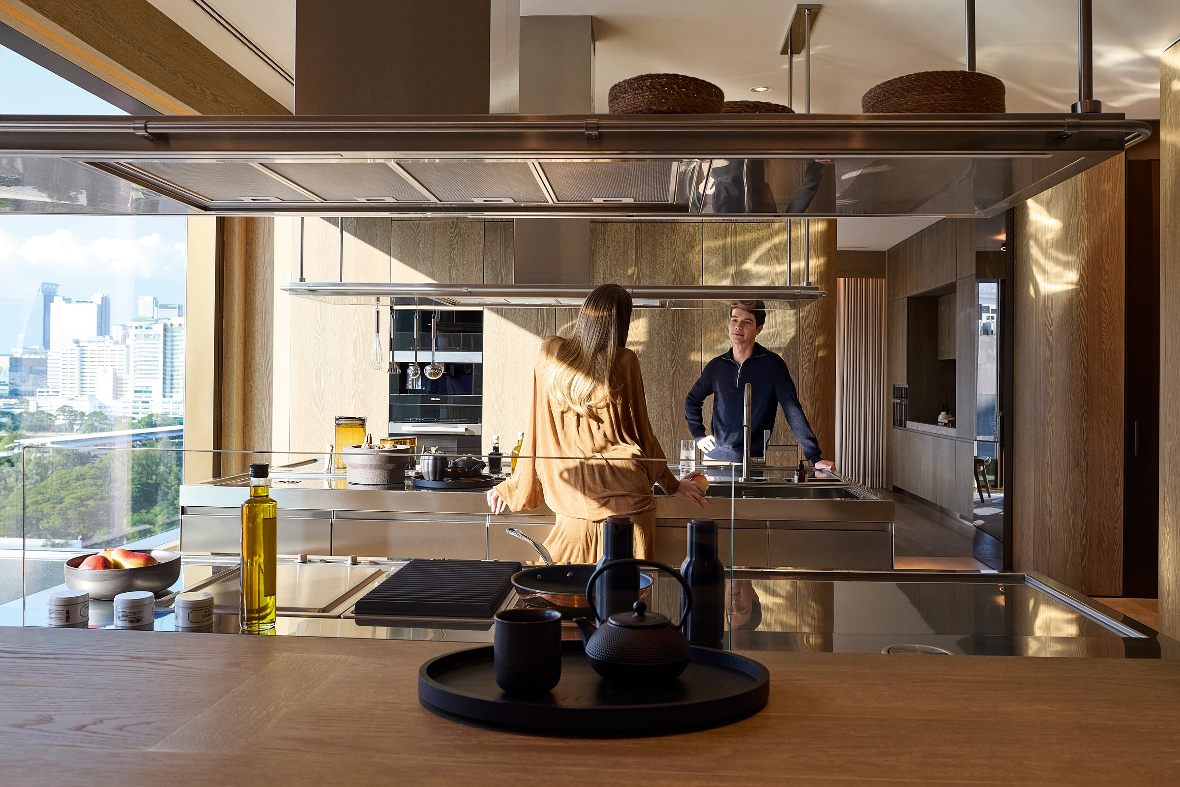 A Sunset Residence kitchen and dining space overlooking Bangkok.