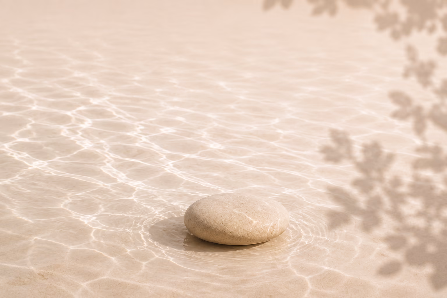 Stone resting in softly rippled water