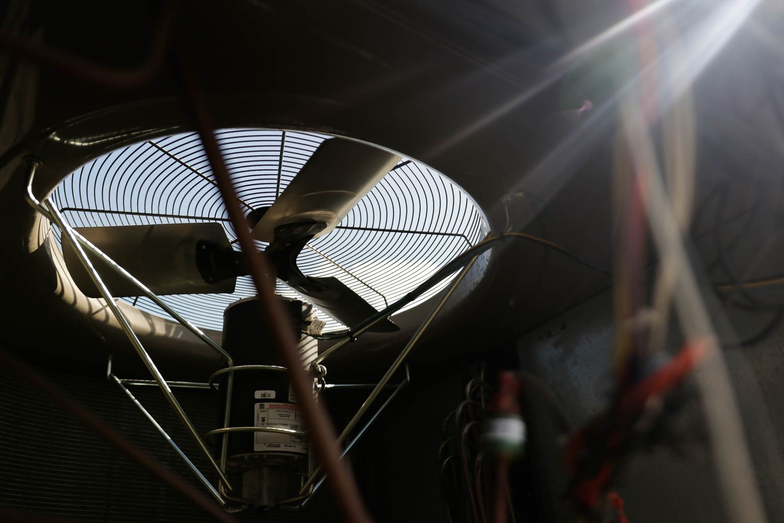 Close-up of an AC condenser fan serviced by Air-Aid AC in the Rio Grande Valley