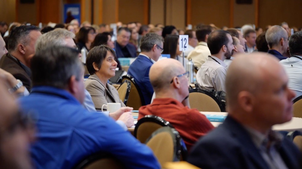 Attendees at a Scaling Up Summit listening to a keynote