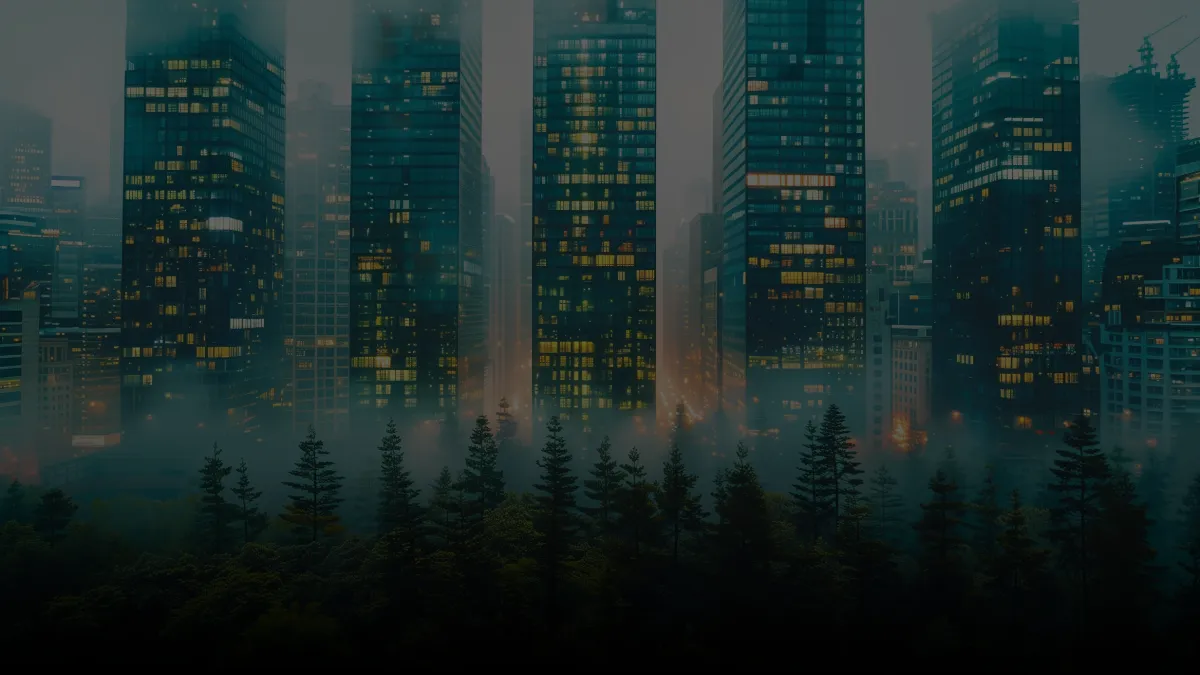 City skyline rising above a misty evergreen forest