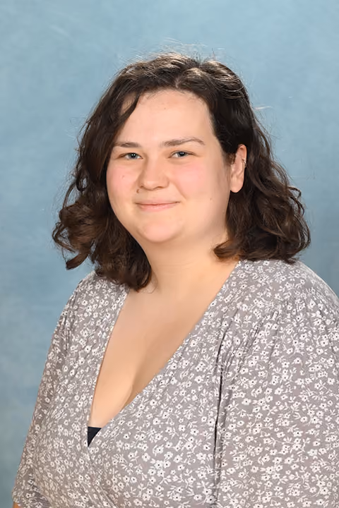 Headshot of Miss D Moore, Teacher.