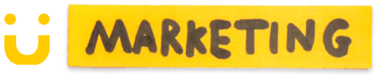 Yellow rectangular block with the word MARKETING in black uppercase letters accompanied by a stylized yellow smiley face with two dots as eyes and a curved line as a mouth.