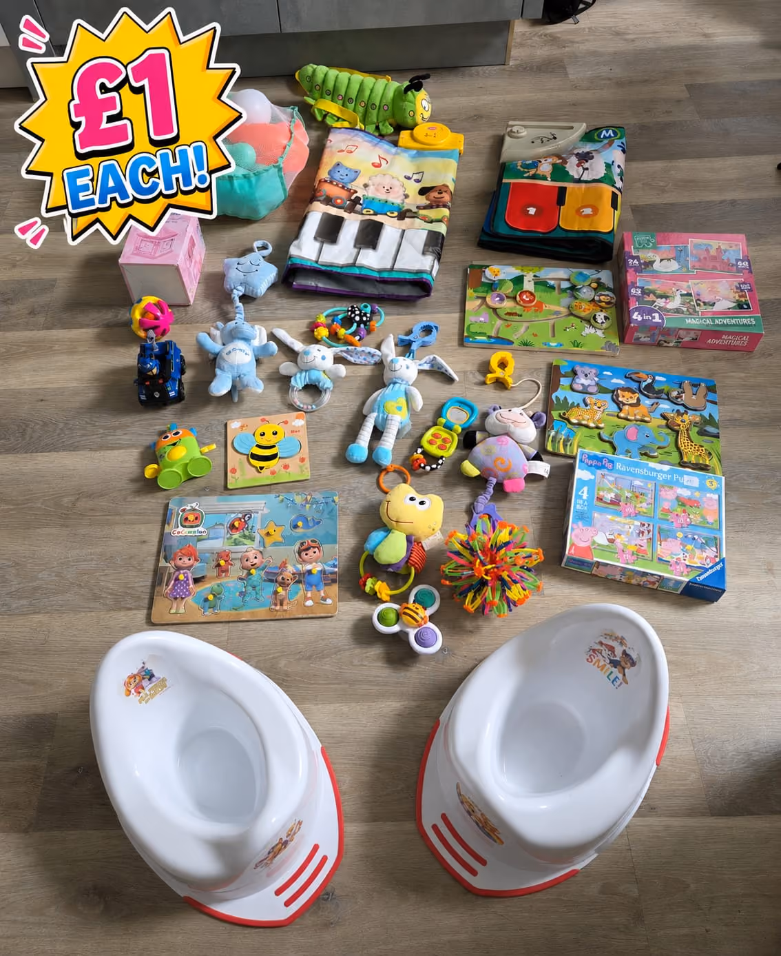 Various children’s toys and two white potties with red accents on a wooden floor, each priced £1.