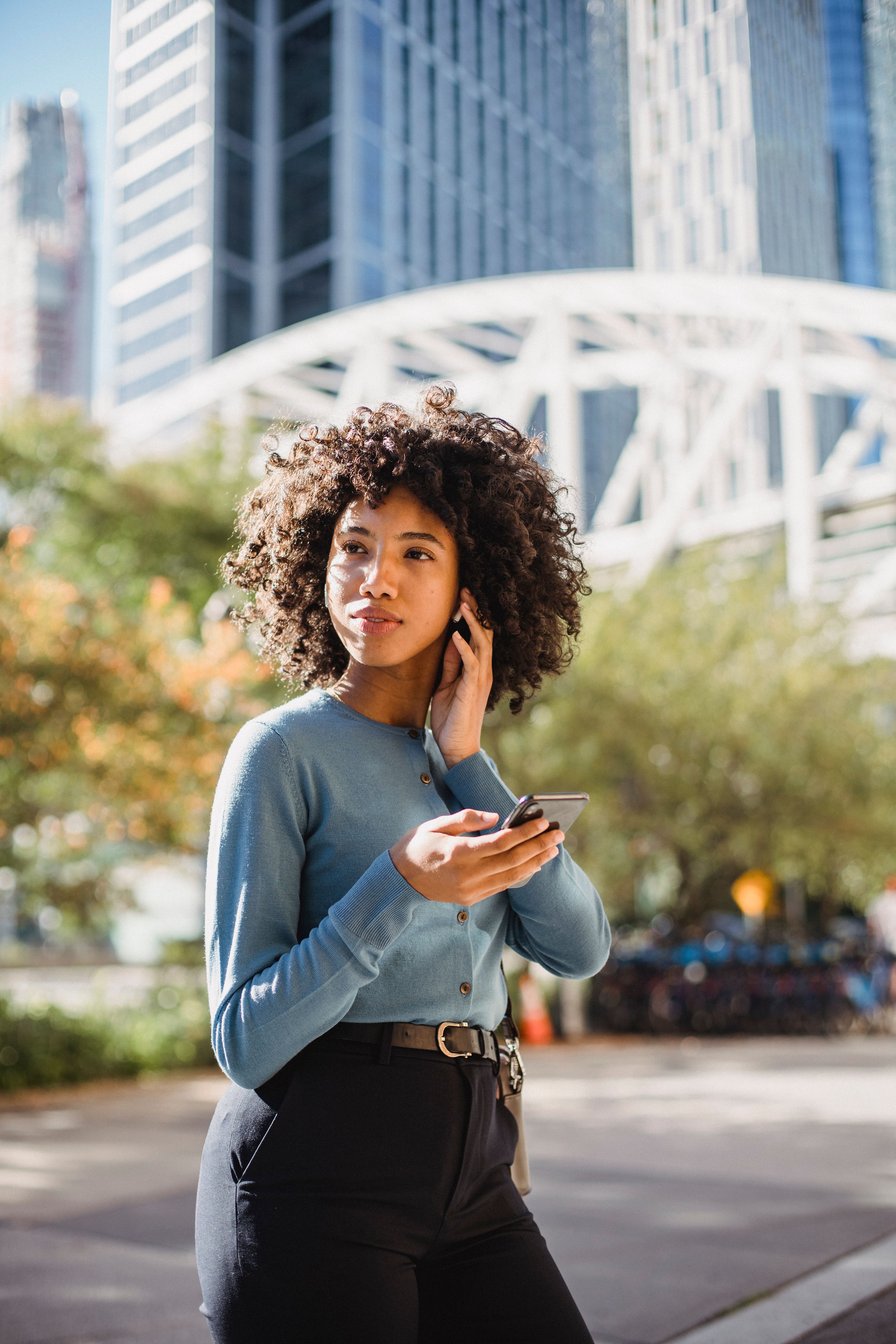 Woman walking with phone stock image