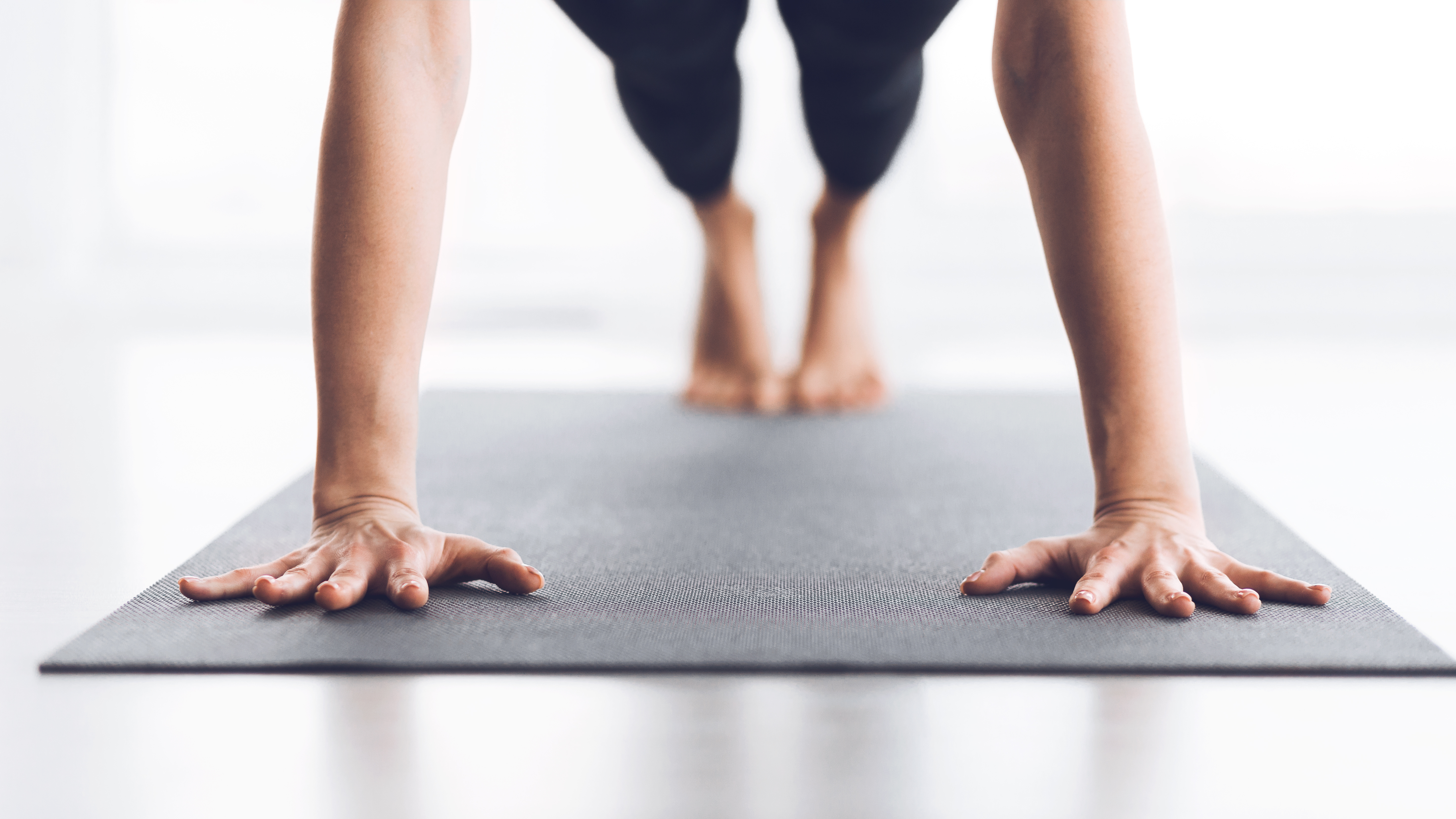 Person doing yoga on mat