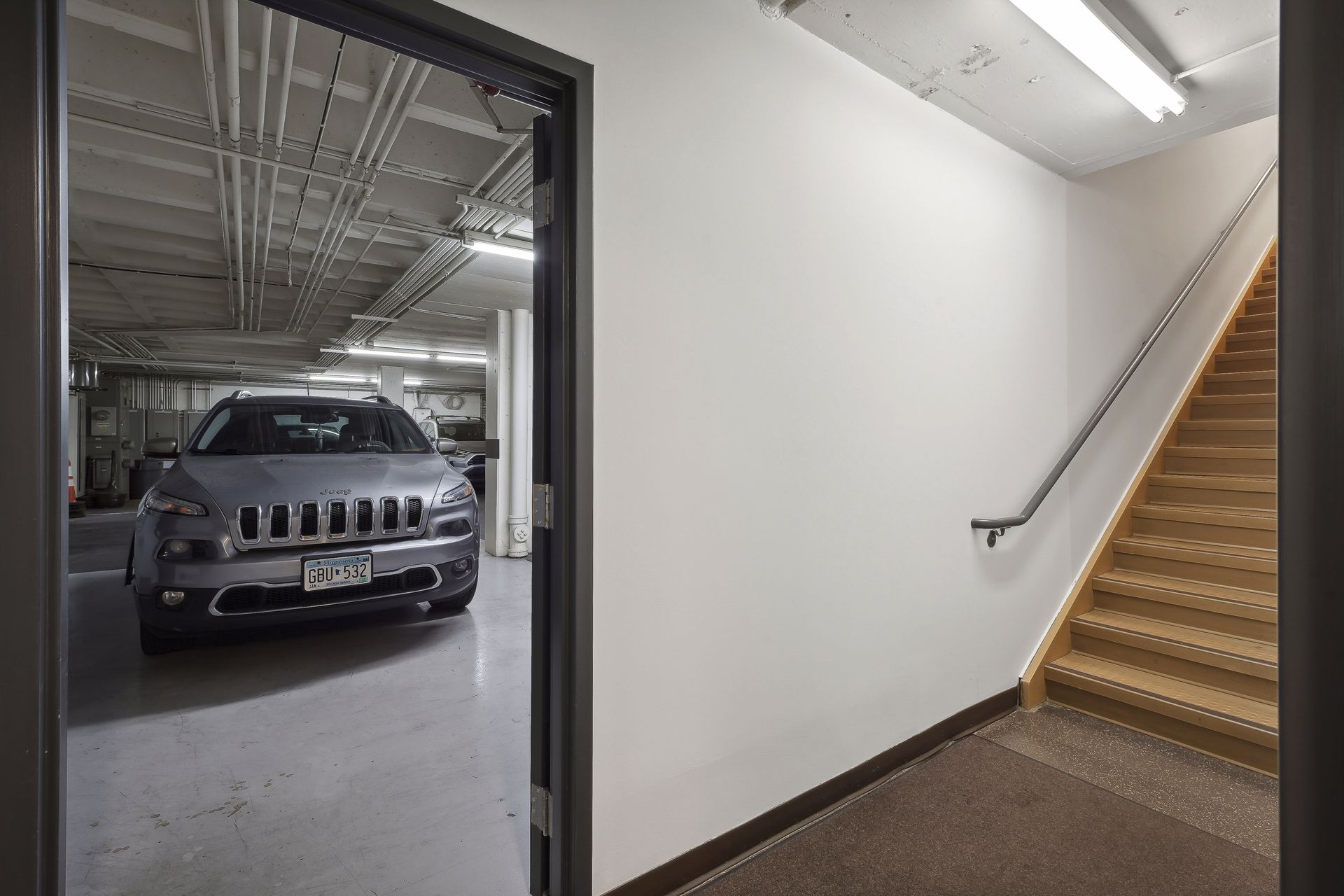 Stair landing leading to the indoor parking garage