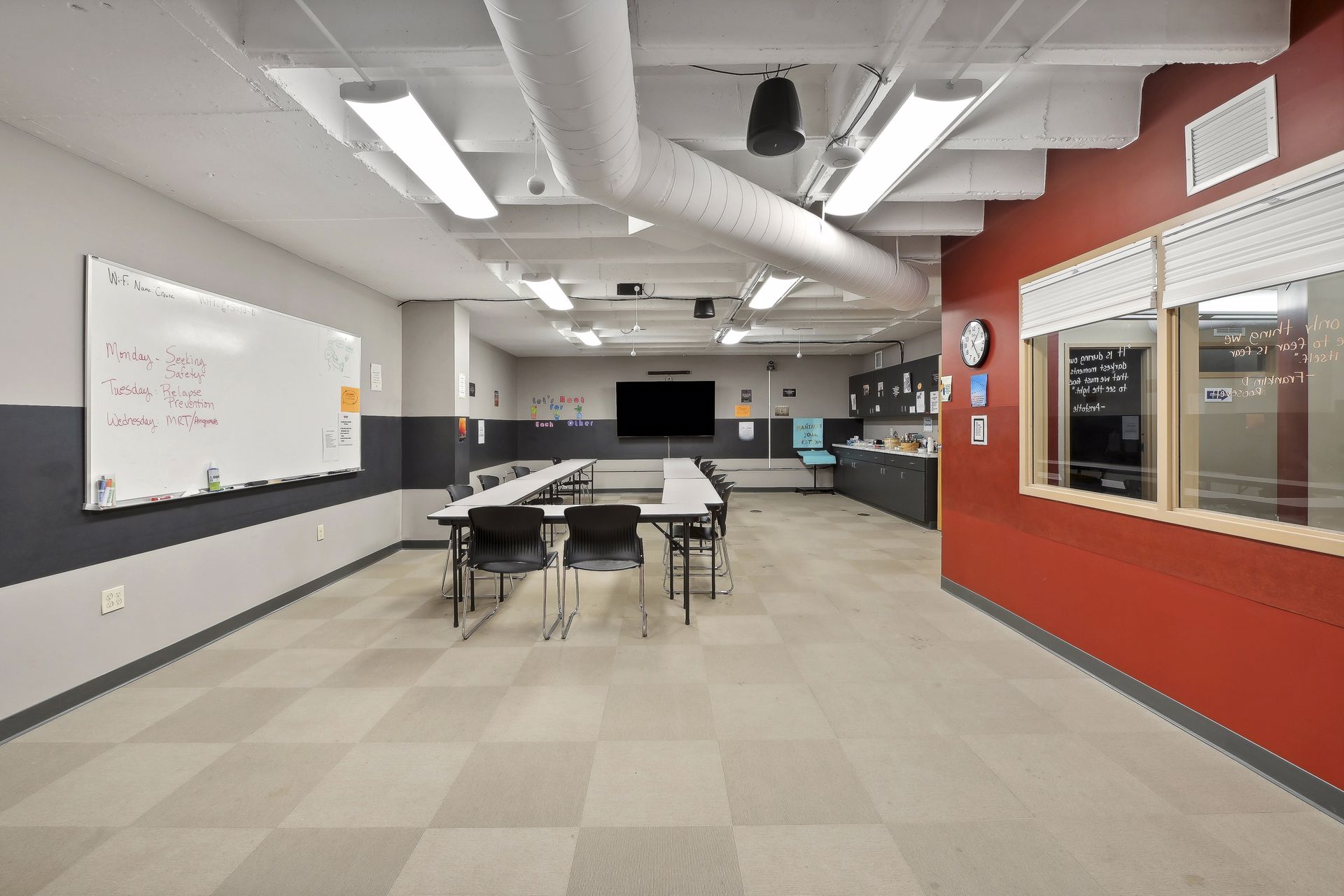 Training room with whiteboard and presentation screen