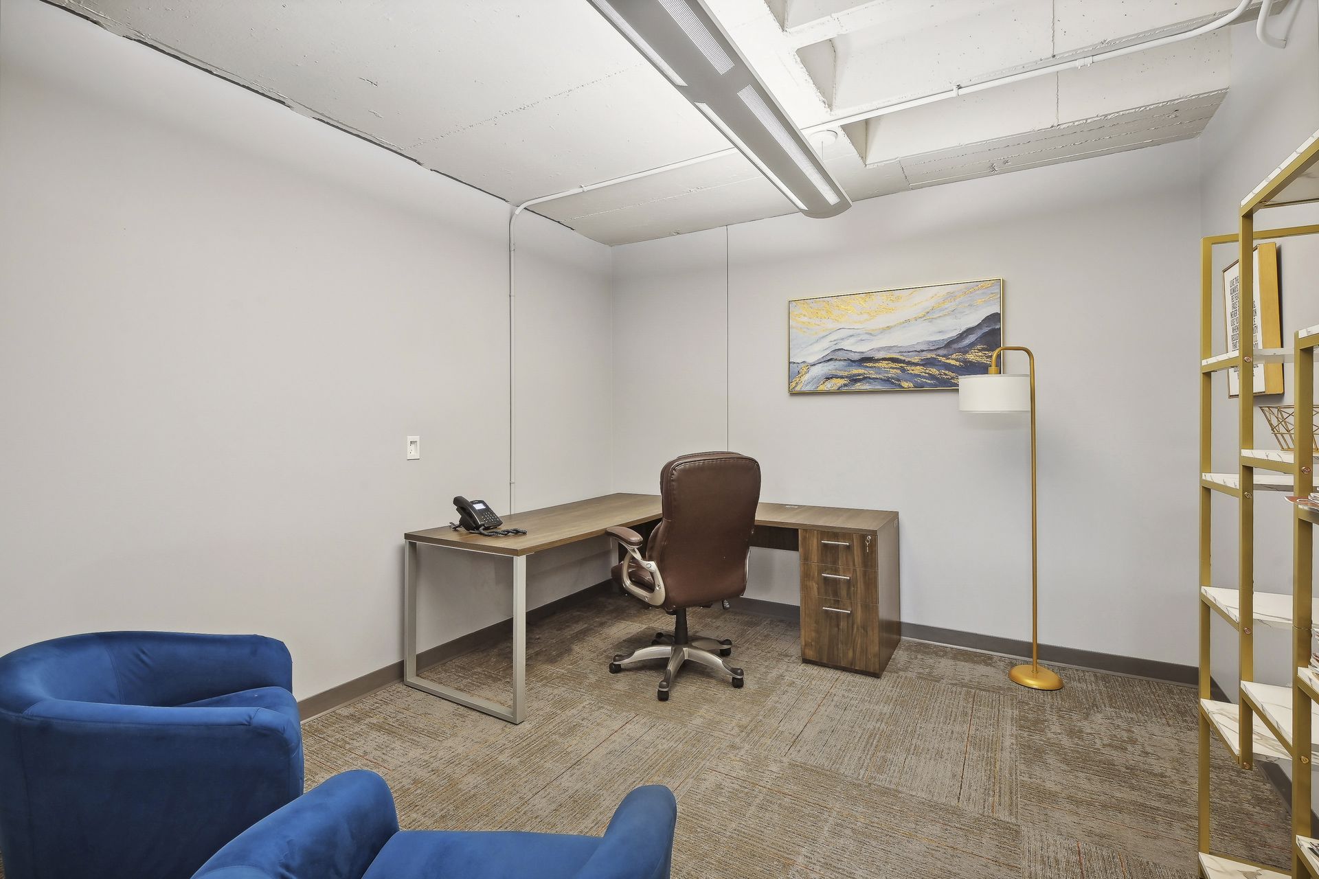 Executive suite office with seating area