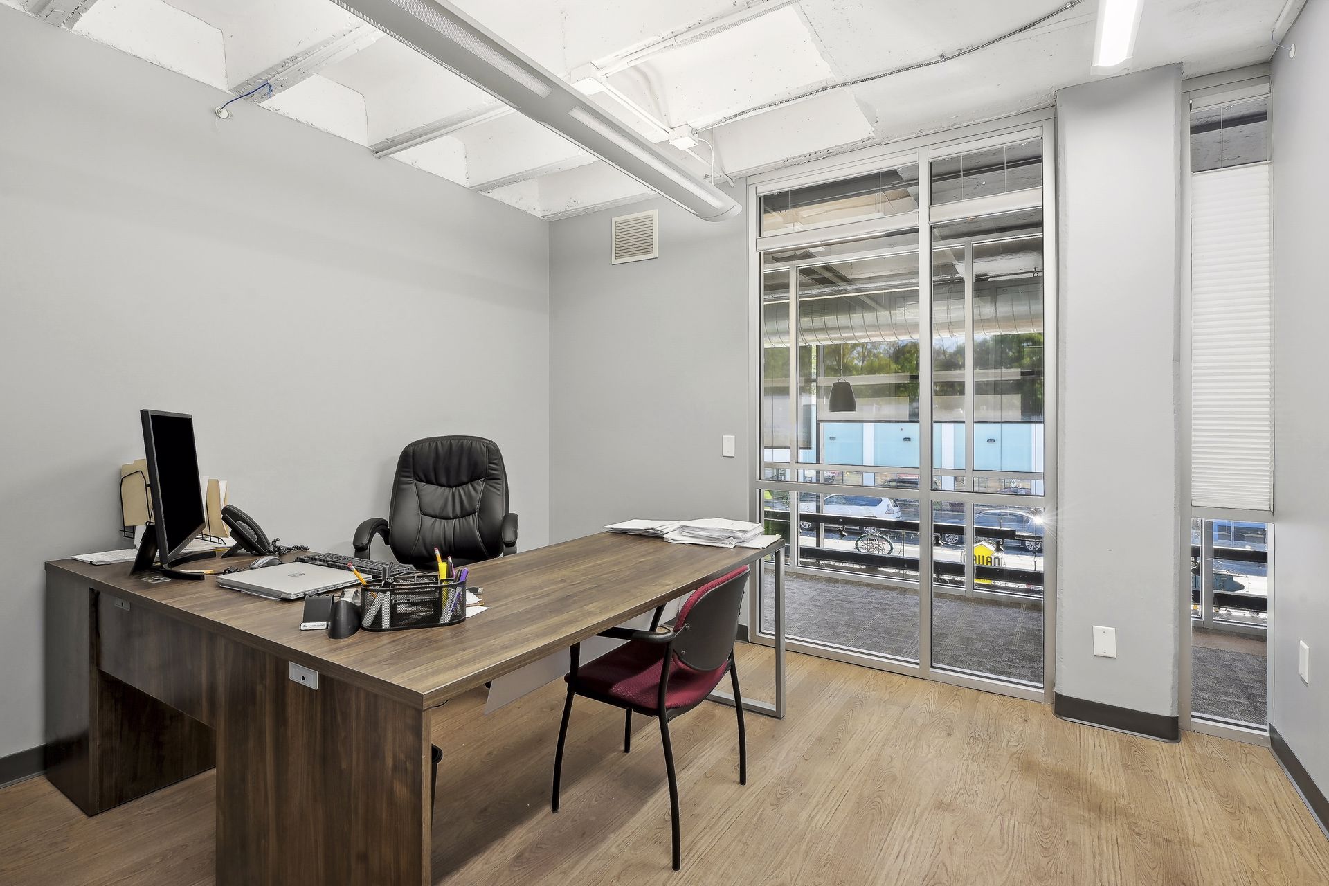 Private office with floor-to-ceiling glass