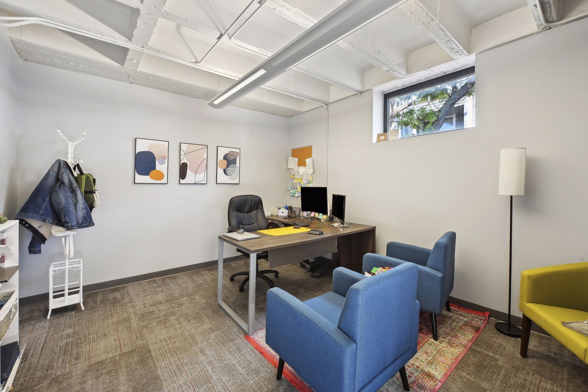 Bright office suite with lounge seating and clerestory windows