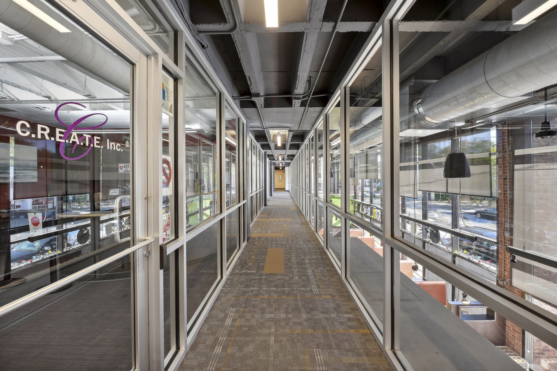 Glazed mezzanine corridor overlooking the atrium