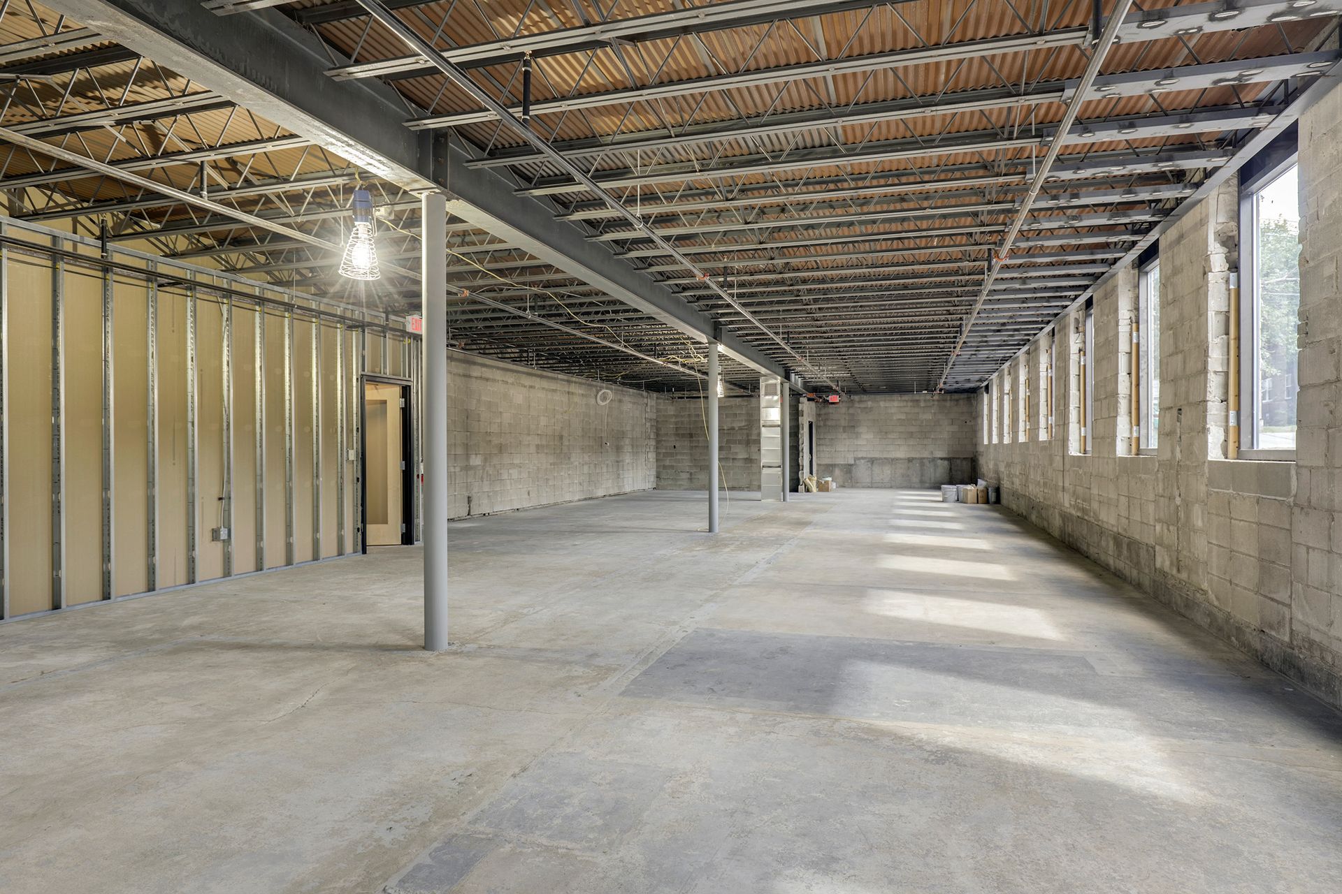 Construction shell with a corrugated metal deck and stud framing in place