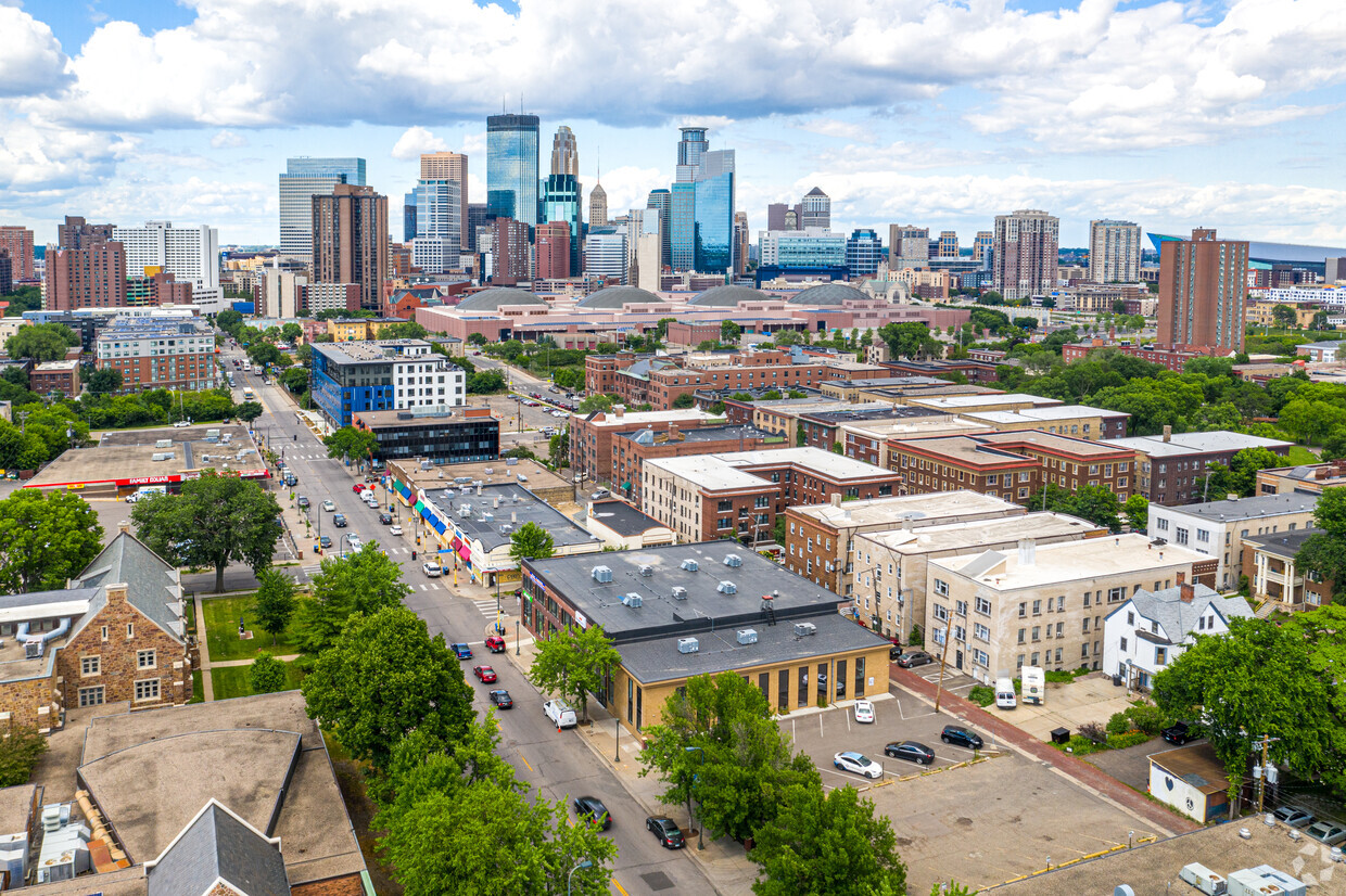 Aerial view over the Stevens Square rooftops toward the downtown Minneapolis skyline